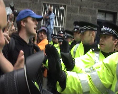 Police holding their line.