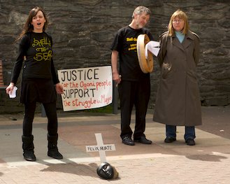 Click on image to see full-sized version Activist sings a moving song about the Shell refinery in Mayo.