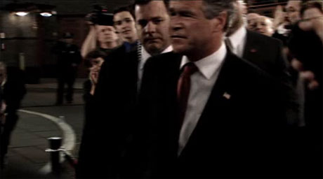 Click on image to see full-sized version about half a second before Bush is shot