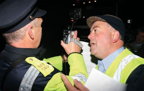Click on image to see full-sized version Willie Corduff appeals to a Gardawho is filming at the daily pre-dawn protest close to Shell's proposed gas refinery at Bellanaboy, Co Mayo, October 2006