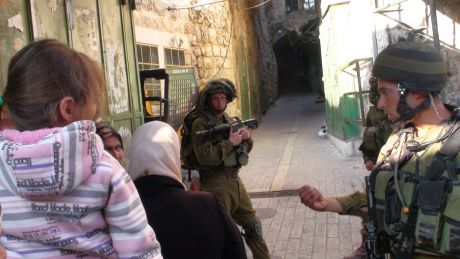 Click on image to see full-sized version Father and child being harassed in Hebron's Old City