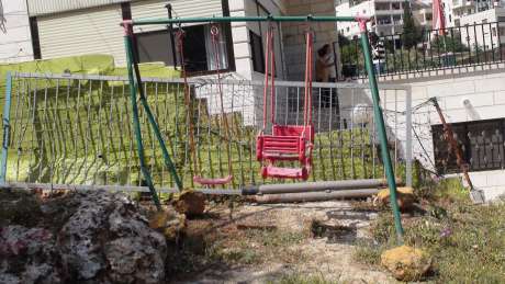 Click on image to see full-sized version Bulldozed in prepartion for a new section of the Apartheid-Annexation Wall, remnant of play area that Mitri Ghneim provided for his four children in Beit Jala