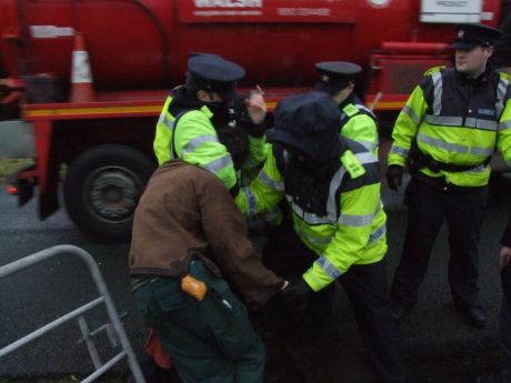 Garda� working hard for Shell. That gate is the entrance to the camp