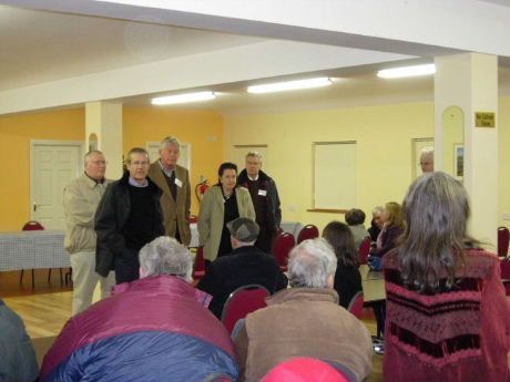 Andy Pyle with non-executive directors Vim Kok (third from left) and Nina Henderson (second from right) line up inside the meeting