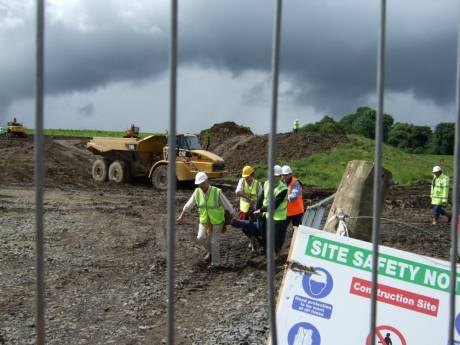 Female protester being carried off