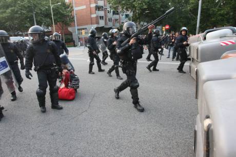 Click on image to see full-sized version riot cops firing rubber bullets at 7am this morning in Barcelona