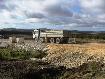 There is a continuous  stream of trucks