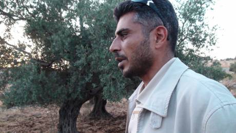 Click on image to see full-sized version Iyad Burnat, head of Bil'in's Popular Committee surveys the damage