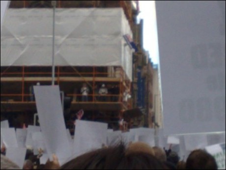 Loyalists on Scaffold Taunting and Lobbing Fireworks and Bottles