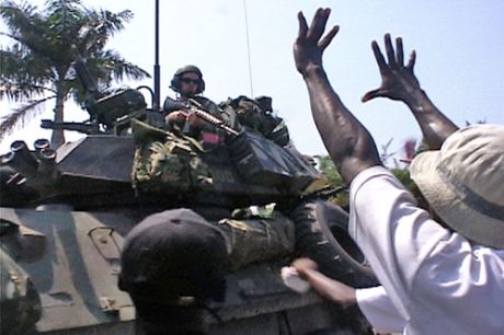 Click on image to see full-sized version Lavalas supporters confront US Marines on March 8, 2004