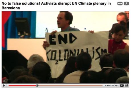 END Co2-Lonialism -  BCN activists disrupt plenary and are met with thunderous applause