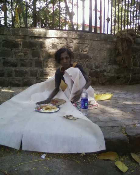 Click on image to see full-sized version Releaved starving women gets a meal and 500 rupees - on the streets of Mumbai, India