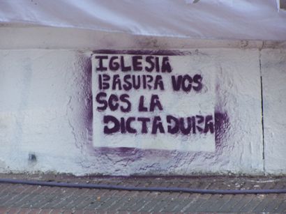 Click on image to see full-sized version "Church, you Trash, you are the Dictatorship". Graffiti makes reference to the Church's collaboration with state terrorism.