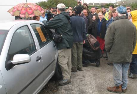 Click on image to see full-sized version Crowd gathers for Maura's statement